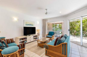 Ivy at Coral Horizons: A Retro Beachfront Locale
